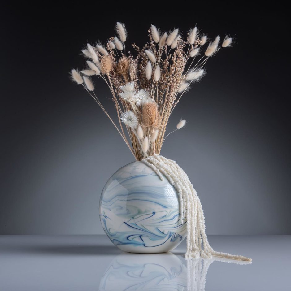 Marbled ceramic vase with dried flowers