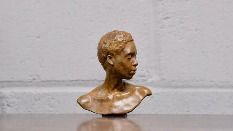 Miniature bronze sculpture woman's face