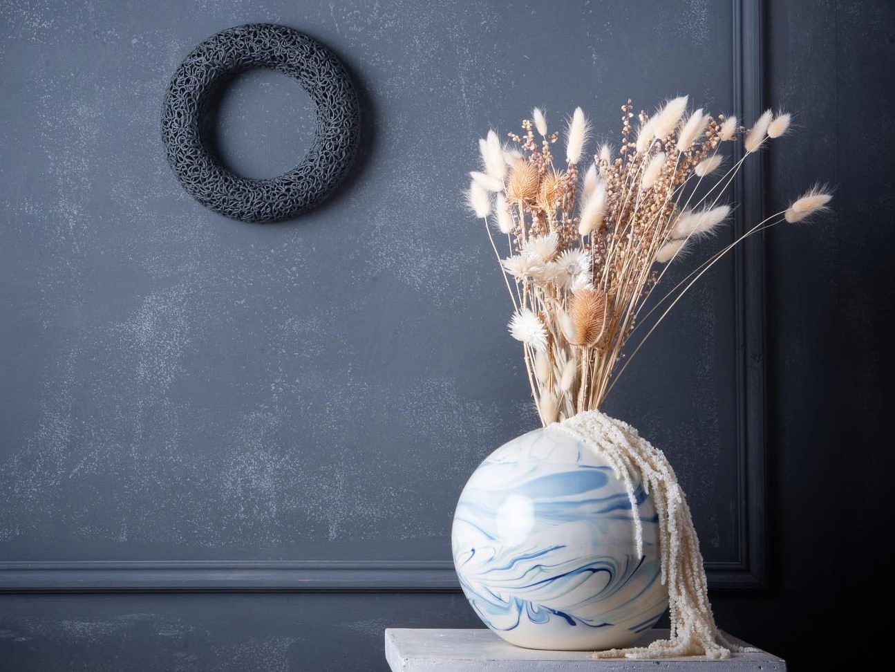 marbled ceramic vase and piped ceramic wall sculpture