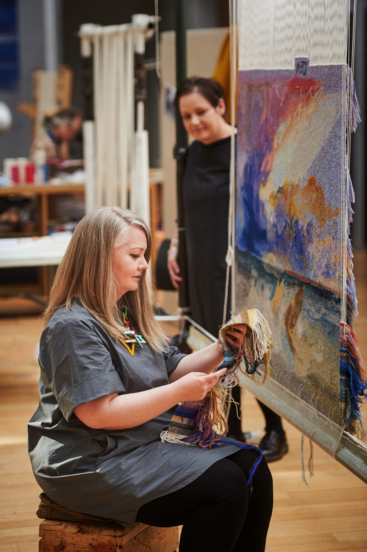 Dovecot Studios, Edinburgh, February 2021.
“The Art of Being An Apprentice”.
Dovecot Apprentice Elaine Wilson (foreground) with her JMW Turner Tapestry.
Pic free for first use relating to Dovecot Studios. Also pictured is Dovecot Studio Manager Naomi Robertson.
For press information please contact Susan McAteer, Marketing and Sales Manager, Dovecot Studios susanmcateer@dovecotstudios.com +44 (0) 131 550 3660
© Malcolm Cochrane Photography 
+44 (0)7971 835 065 
mail@malcolmcochrane.co.uk 
No syndication 
No reproduction without permission