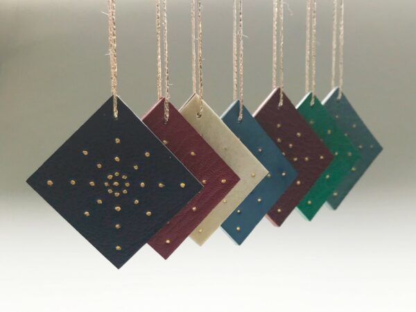 Gold Tooled Leather Ornaments by Toben Lewis