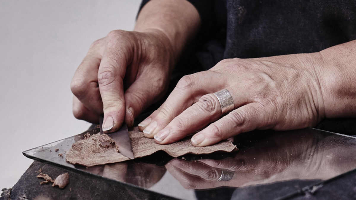 Carreducker shoe making - Deborah Carre skiving leather - photo by Jonathan Stewart