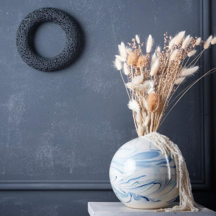 marbled ceramic vase and piped ceramic wall sculpture