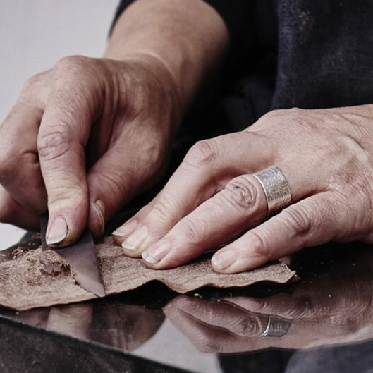 Carreducker shoe making - Deborah Carre skiving leather - photo by Jonathan Stewart