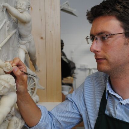 Felix Thornton-Jones working on a marble relief (sculptor - John Deare 1796) that is now in the collections of the V&A